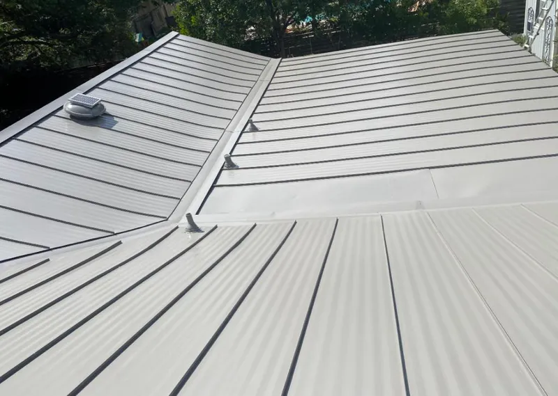 Solar attic fan installed on a metal roof for Roof Ventilation in El Monte